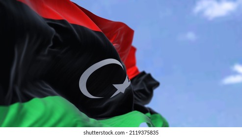 Detail of the national flag of Libya waving in the wind on a clear day. Patriotism. North african country. Selective focus.