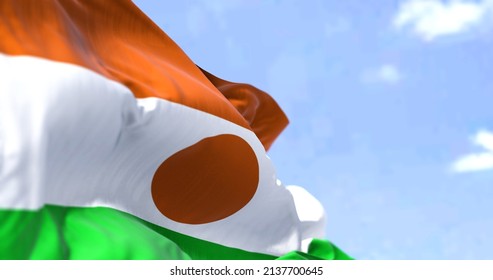 Detail Of The National Flag Of Niger Waving In The Wind On A Clear Day. Niger Is A Landlocked Country In West Africa. Selective Focus.