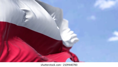 Detail Of The National Flag Of Poland Waving In The Wind On A Clear Day. Democracy And Politics. European Country. Selective Focus.