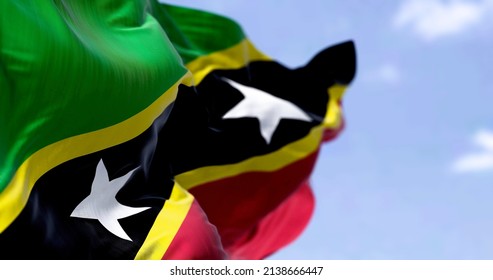 Detail of the national flag of Saint Kitts and Nevis waving in the wind on a clear day. Saint Kitts and Nevis is an island country in the West Indies. Selective focus.