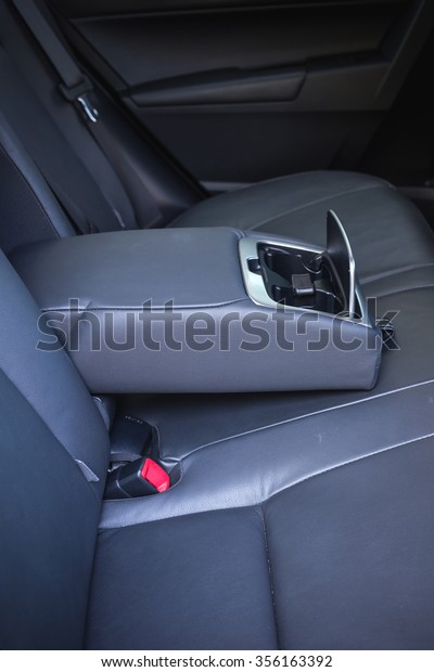 Detail of\
new modern car interior, Focus on rear\
seat
