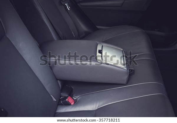 Detail of\
new modern car interior, Focus on rear seat\
