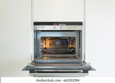 Detail Of New Oven.  Door Is Open And Light Is On