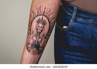 Detail Of New Tattoo Of 'La Santa Muerte' (Our Lady Of Holy Death) In The Arm Of A Woman