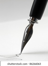 detail of a nib tip while drawing a line in light back