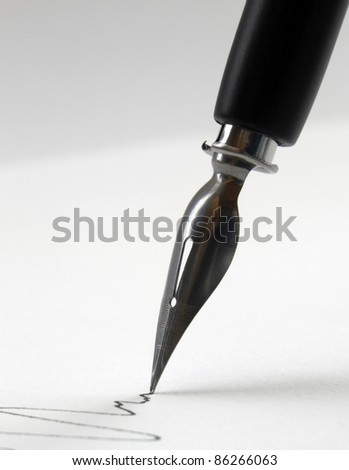 detail of a nib tip while drawing a line in light back