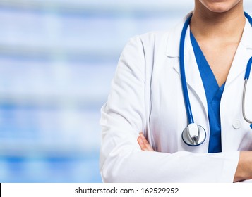 Detail of a nurse uniform on a blue blurred background