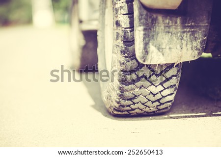 Detail of a Off-Road Tire Covered with Mudd