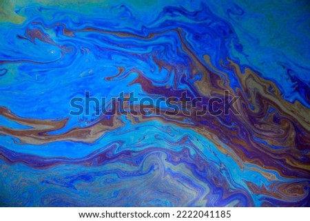 Detail of an oil spillage in open water 