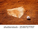 Detail of old baseball on dirt next to home plate homeplate scoring competition in sports