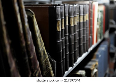 Detail With Old Books On A Shelf Inside An Archive Room