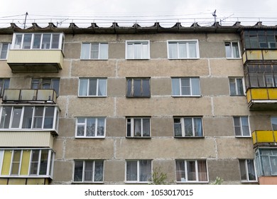 Detail of old five-story building on the outskirts in a residential area. Cheap accommodation built during the Khrushchev and Brezhnev.