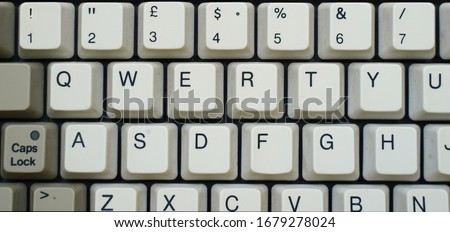 detail of a old keyboard, vintage 90 ', qwerty, without background               