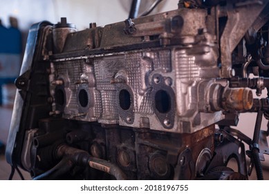 Detail Of Old And Rusty Car Engine In A Workshop