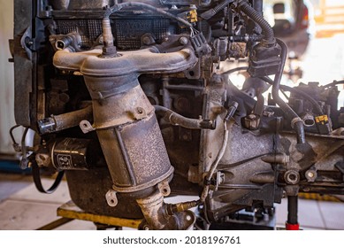 Detail Of Old And Rusty Car Engine In A Workshop