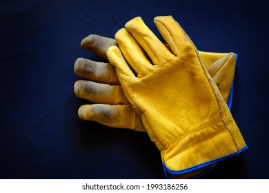 Detail of old worn leather work gloves workgloves texture