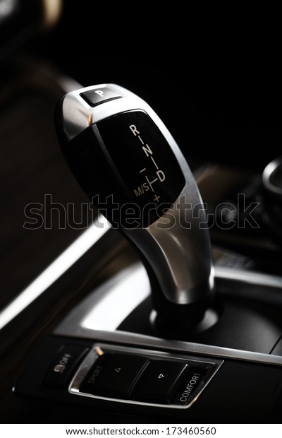 Detail on a\
automatic gear shifter in a new\
car