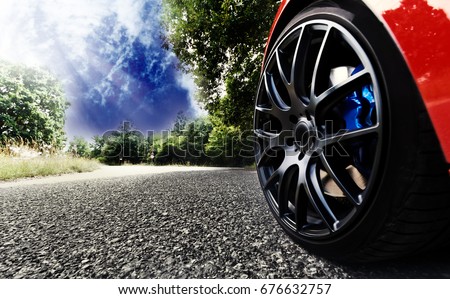 Detail on hot red sport car wheels with sport breaks