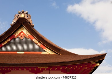 Detail On Japanese Temple Roof Against Blue Sky.