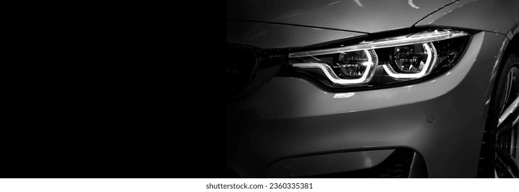 Detail on one of the LED headlights modern car on black background	 - Powered by Shutterstock