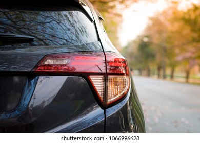 Detail On The Rear Light Of A Car. Gray Car At Park. Copy Space.