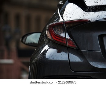 Detail on the rear light of a car. Grey car rear light close up