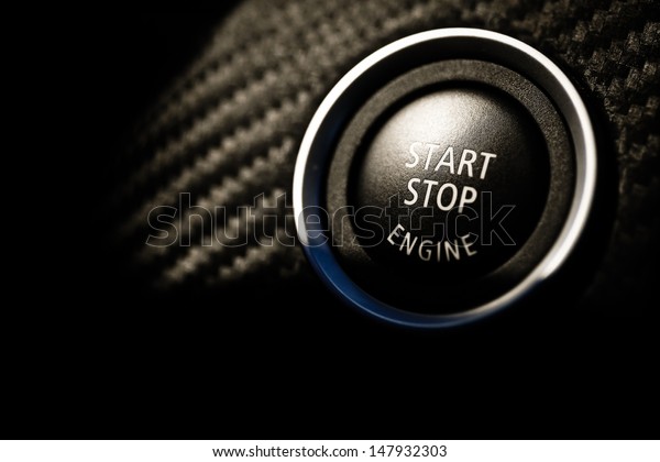 Detail on the start button\
in a car
