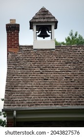 Detail Of One Room Schoolhouse Roof Featuring Chimney Cedar Shakes And School Bell Cupola