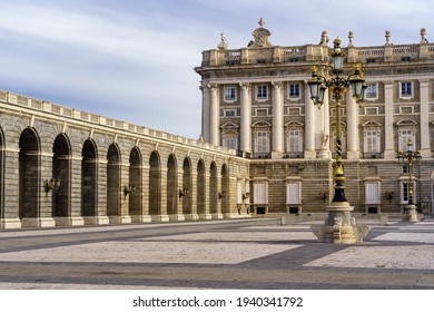 Detail of the outer courtyard of the royal palace of Madrid, with lampposts, arches and neoclassical style. Spain.