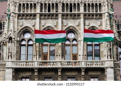 Detail of Parliament in Budapest, Hungary, with waving Hungarian flags