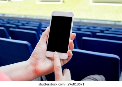 Detail Of People Using Smart Phone In The Soccer Stadium