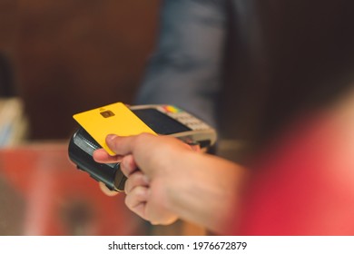 Detail Of A Person Paying With A Credit Card