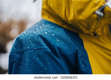Detail photo of wateproof jacket with water droplets on it. Jacket using the gore-tex technology.