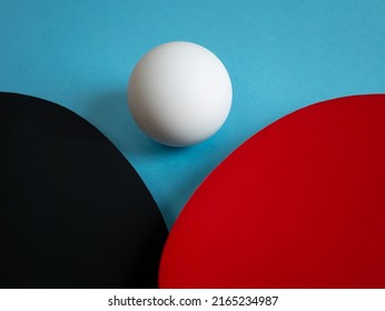 Detail of pingpong rackets and ball isolated on light blue background. Equipment for playing table tennis.