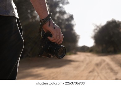 detail plane shakes hands of a photographer with the camera in landscape - Powered by Shutterstock