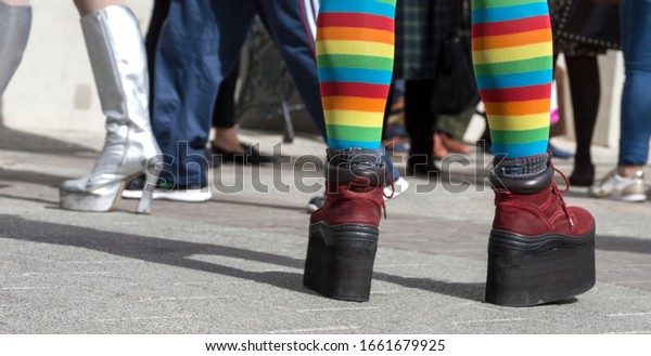detail\
of platform shoes with lgtbi socks on the\
street