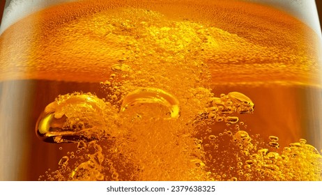 Detail of Pouring Beer Into Glass, Close-up. Abstract Beverages Background.