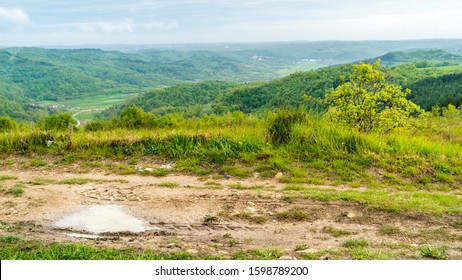 Detail Of A Puddle In A Trail In The Mountains Of Croatia, Istria, With Signs Of  Tires Of Off Road Vehicles Like Jeep Cars Bike Motorbike 