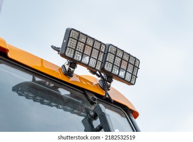 Detail Of The Rear Of A New Utility Truck. Taillights, Electrical Connectors, Plastic Mudguards, Wheels And Rims. Red Brake Lights And Orange Turn Signals. Road Safety