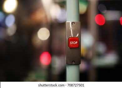 Detail Of Red Stop Button Inside Double Decker Bus In London, UK, De-focused Lights In The Blurred Background.
