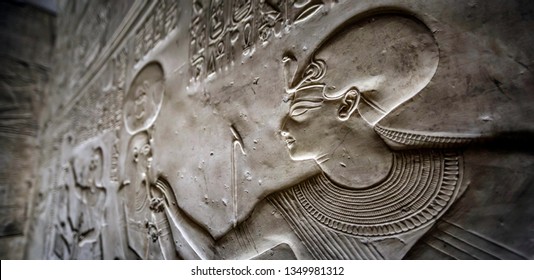 Detail of the relief, drawing with hieroglyphs based on the mythology of ancient Egypt - Temple of Sethy the First at Abydos - Middle Egypt - Shutterstock ID 1349981312