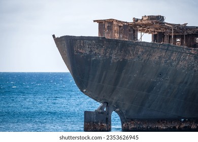 Detail of the rusty stern of a ship stranded on the coast of Arrecife in Lanzarote, called Telamón. Rusty ship. Stranded ship. Broken ship. Lanzarote, Canary Islands, Spain - Shutterstock ID 2353626945