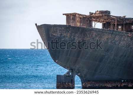 Detail of the rusty stern of a ship stranded on the coast of Arrecife in Lanzarote, called Telamón. Rusty ship. Stranded ship. Broken ship. Lanzarote, Canary Islands, Spain