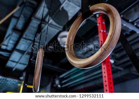 Detail of a set of rings, or steady rings, in a gymnasium. healthy lifestyle and fitness concept
