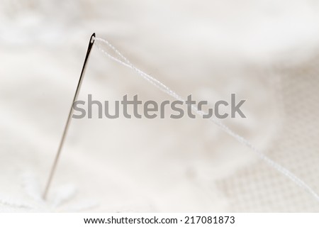 Detail of a sewing needle ready to