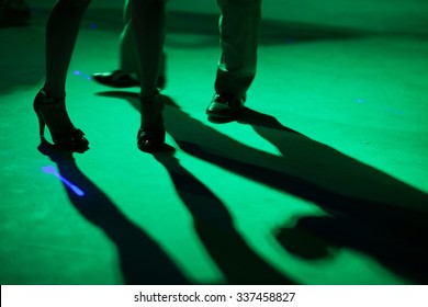 Detail Of Shoes With Shadows In Milonga Ballroom.