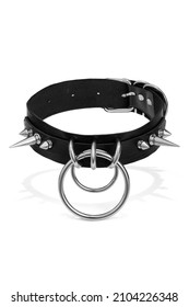 Detail shot of black leather choker with steel spike rivets and metal rings. Stylish adjustable choker with metal buckle is isolated on the white background.  