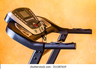 Detail Shot Of The Control Panel Of A Tread Mill In A Small Home Gym