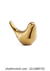 Detail Shot Of A Figurine Of A Golden Shiny Bird With A Raised Tail. The Porcelain Statuette Is Isolated On The White Background.