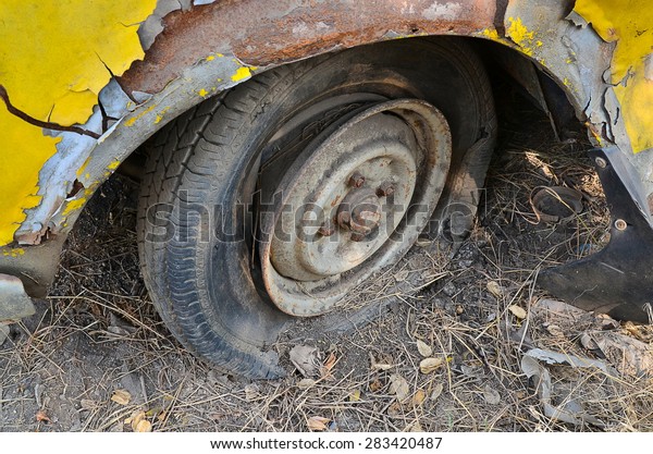 Detail Shot of a Flat Tire on a Old Car Selection\
Focus on Tire